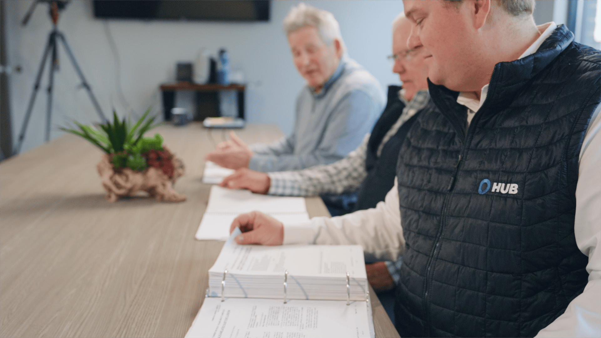 HUB Team Haugen advisors reviewing a commercial insurance program